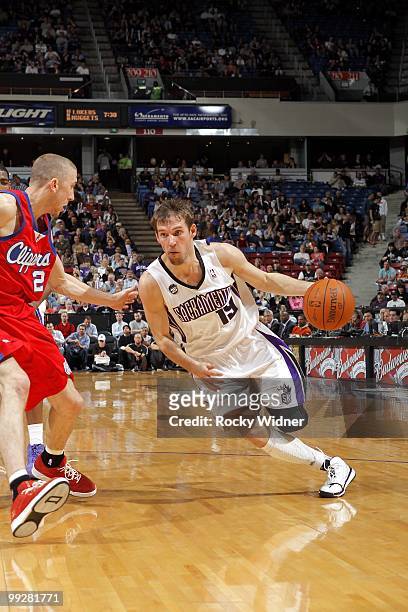 Beno Udrih of the Sacramento Kings drives to the basket against Steve Blake of the Los Angeles Clippers during the game at Arco Arena on April 8,...