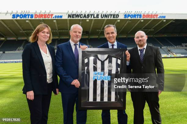 Bank of England Governor Mark Carney poses for a photo with the Head of Newcastle United Foundation Kate Bradley, Chair of Trustees John Marshall and...