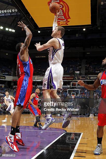 Andres Nocioni of the Sacramento Kings goes up for a shot against Rasual Butler of the Los Angeles Clippers during the game at Arco Arena on April 8,...