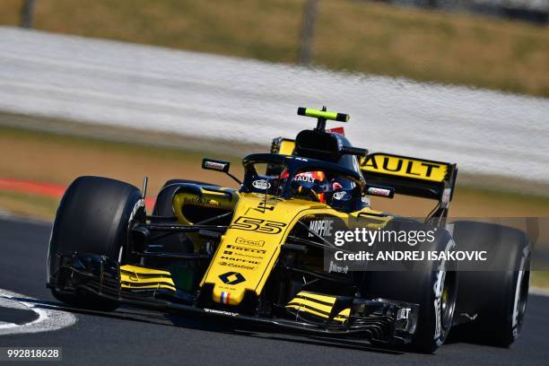 Renault's Spanish driver Carlos Sainz Jr drives during the second practice session at Silverstone motor racing circuit in Silverstone, central...