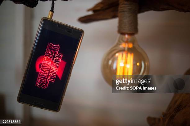 In this photo illustration, the logo 'Stranger Things 2' from the Netflix TV serie seen displayed on a Sony smartphone.