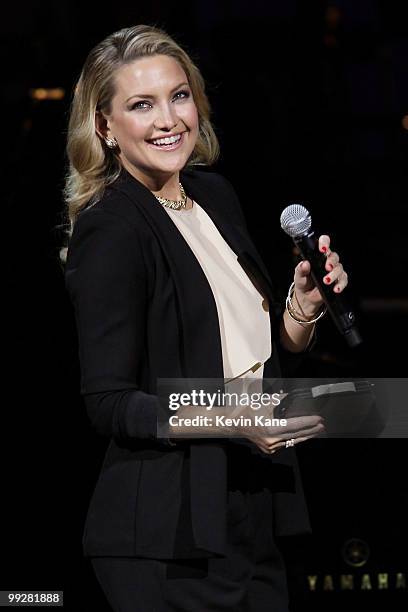 Kate Hudson speaks on stage during the Almay concert to celebrate the Rainforest Fund's 21st birthday at Carnegie Hall on May 13, 2010 in New York...