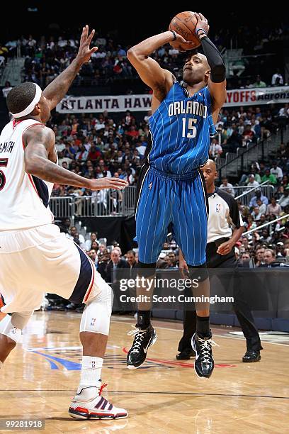 Vince Carter of the Orlando Magic shoots over Josh Smith of the Atlanta Hawks in Game Four of th Eastern Conference Semifinals during the 2010 NBA...