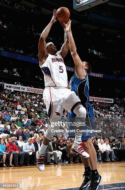 Josh Smith of the Atlanta Hawks goes to the basket against Ryan Anderson of the Orlando Magic in Game Four of th Eastern Conference Semifinals during...
