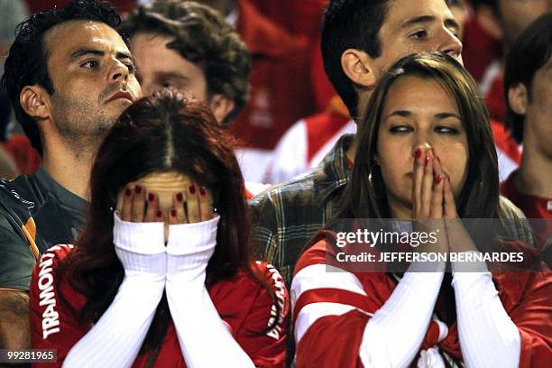 Supporters of Brazilian team Internacional watch the Libertadores Cup football match against Argentina's team Estudiantes, in Porto Alegre, Brazil on...