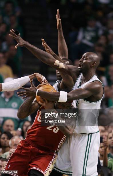 Kevin Garnett and Kendrick Perkins of the Boston Celtics keep LeBron James of the Cleveland Cavaliers from the basket in the first half during Game...