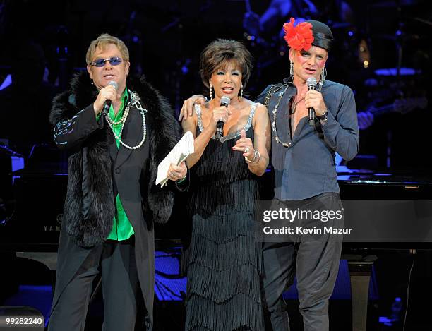 Elton John, Dame Shirley Bassey and Sting perform on stage during the Almay concert to celebrate the Rainforest Fund's 21st birthday at Carnegie Hall...