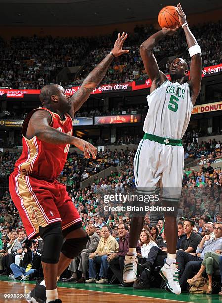 Kevin Garnett of the Boston Celtics goes up for a shot against Shaquille O'Neal of the Cleveland Cavaliers in Game Six of the Eastern Conference...