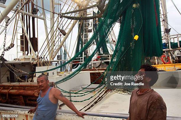 Fallguy Lee and Dranson Pham pass time away on the shrimp boat they work on after the owner shut down operations due to the massive oil spill in the...