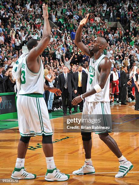 Kevin Garnett and Kendrick Perkins of the Boston Celtics celebrate after a win against the Cleveland Cavaliers in Game Six of the Eastern Conference...