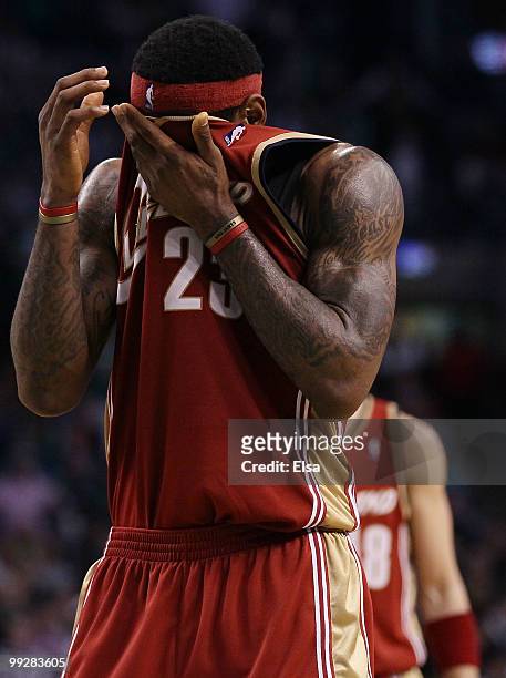 LeBron James of the Cleveland Cavaliers wipes the sweat from his face in the fourth quarter against the Boston Celtics during Game Six of the Eastern...