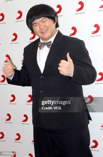 Lin Yu Chun, nicknamed as Taiwan's Susan Boyle, poses for photos during the signing ceremony with Sony Music on May 13, 2010 in Shanghai, China.