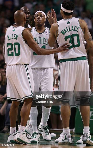 Paul Pierce of the Boston Celtics is congratulated by teammates Ray Allen, Rasheed Wallace and Kevin Garnett after Pierce drew the foul from the...