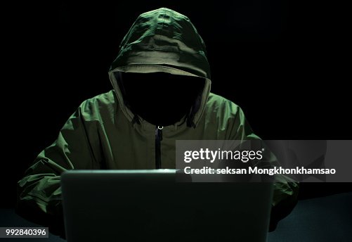 Hacker stealing password and identity, computer crime Hacker stealing password and identity, computer crime