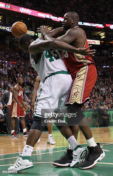 Kendrick Perkins of the Boston Celtics and Shaquille O'Neal of the Cleveland Cavaliers fight for the ball during Game Six of the Eastern Conference...