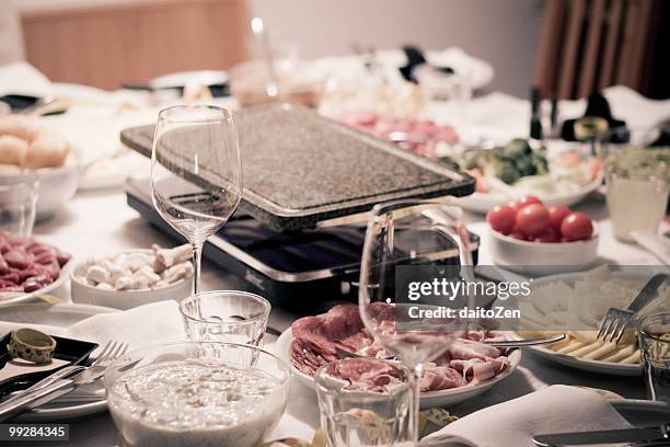 raclette on new year's eve - cheese stock photos et images de collection