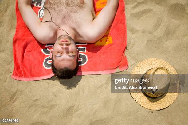 man on the beach - man in straw hat stock pictures, royalty-free photos & images