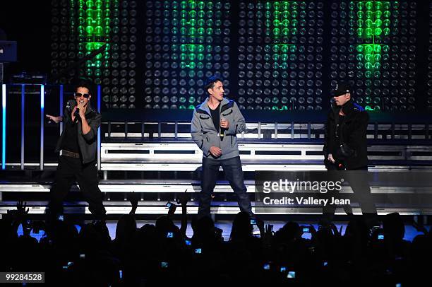 Joey McIntyre, Jonathan Knight and Donnie Wahlberg of New Kids on the Block perform at Fillmore Miami Beach on May 13, 2010 in Miami Beach, Florida.