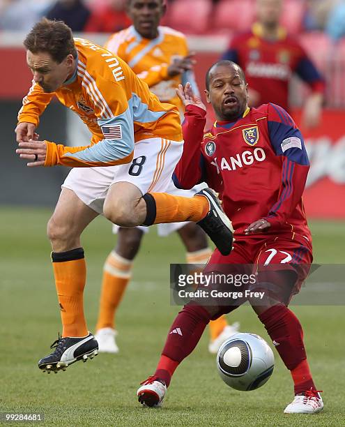 Real Salt Lake's Andy Williams and Houston Dynamo's Richard Mulrooney fight fo the ball during the first half of an MLS soccer game in May 13, 2010...