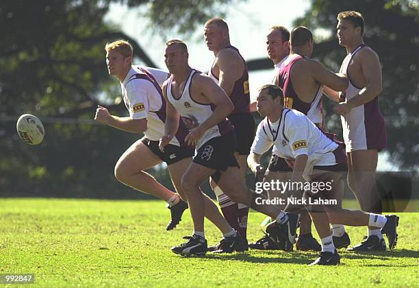 Paul Green of Queensland passes from the back of the scrum during the Queensland State of Origin teams training held at Scots College, Sydney,...