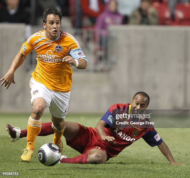 Real Salt Lake's Collen Warner has the ball taken from hi\m by Houston Dynamo's Danny Cruz during the second half of an MLS soccer game in May 13,...