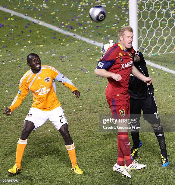 Real Salt Lake's Nat Borchers heads the ball away from his goal as Houston Dynamo's Dominic Oduro looks on during the second half of an MLS soccer...