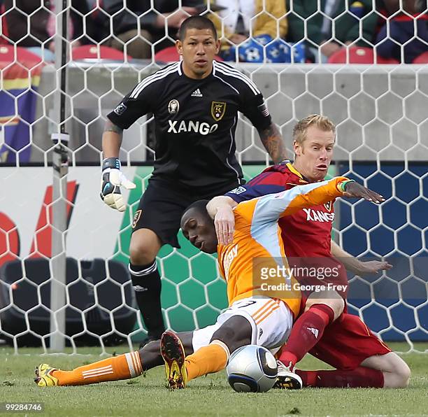 Real Salt Lake's Nat Borchers fights for the ball with Houston Dynamo's Dominic Oduro as Salt Lake Goalie goalkeeper Nick Rimando looks on during the...