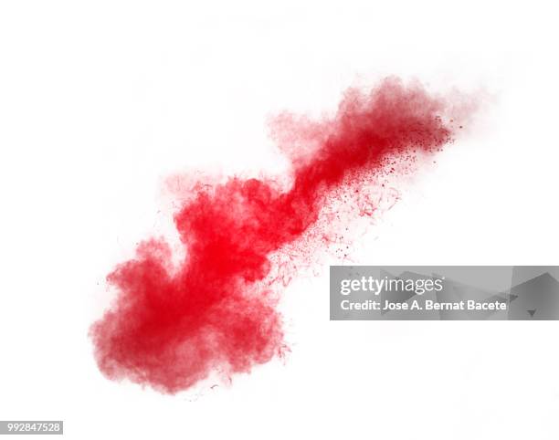 full frame of forms and textures of an explosion of powder and smoke of color yellow and red on a white background. - vernice in polvere foto e immagini stock