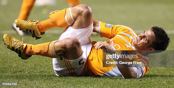 Houston Dynamo's Danny Cruz grimaces in pain during a game against Real Salt Lake during the second half of an MLS soccer game in May 13, 2010 in...