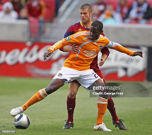 Real Salt Lake's Chris Wingert and Houston Dynamo's Lovel Palmer fight for the ball during the first half of an MLS soccer game in May 13, 2010 in...