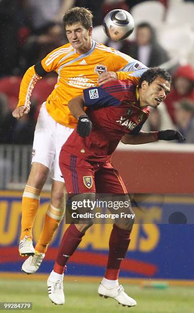 Real Salt Lake's Paublo Campos heads the ball with Houston Dynamo's Bobby Boswell during the second half of an MLS soccer game in May 13, 2010 in...