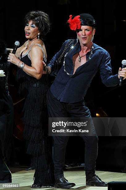 Musicians Sting and Dame Shirley Bassey perform on stage during the Almay concert to celebrate the Rainforest Fund's 21st birthday at Carnegie Hall...