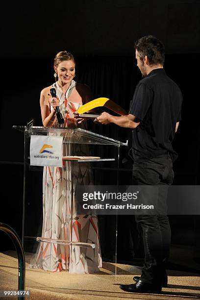 Actress Bella Heathcote, recipient of AIF Heath Ledger Scholarship award, and actor Colin Farrell speak at Australians In Film's 2010 Breakthrough...