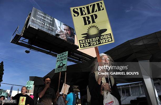 Protester shouts slogans against BP during a demonstration in front of the BP "Green Curve" Station, in Los Angeles, California, on May 12, 2010. BP...