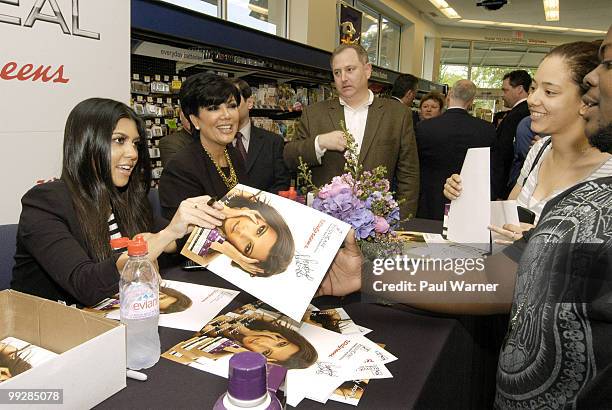 Kourtney Kardashian and Kris Jenner sign autographs at the Rejuvicare launch at Walgreens on May 13, 2010 in Lake Bluff, Illinois.