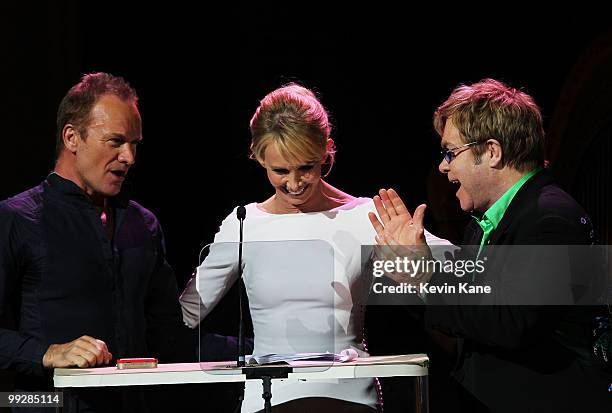 Sting, Trudie Styler and Elton John perform on stage during the Almay concert to celebrate the Rainforest Fund's 21st birthday at Carnegie Hall on...