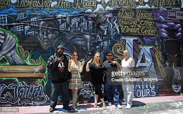 Formers gang members, Melvin Johnson from the "Crips" , Alfred Lomas from the "Florencia 13" and Max Maestas from the "18th Street" pose with...