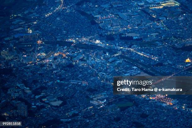 hirakata city in osaka prefecture in japan twilight time aerial view from airplane - hirakata city stock pictures, royalty-free photos & images