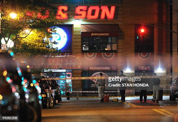 New York Police Department officers investigate a gasoline can early Friday, May 14, 2010 after being found in a suspicious vehicle near Union Square...