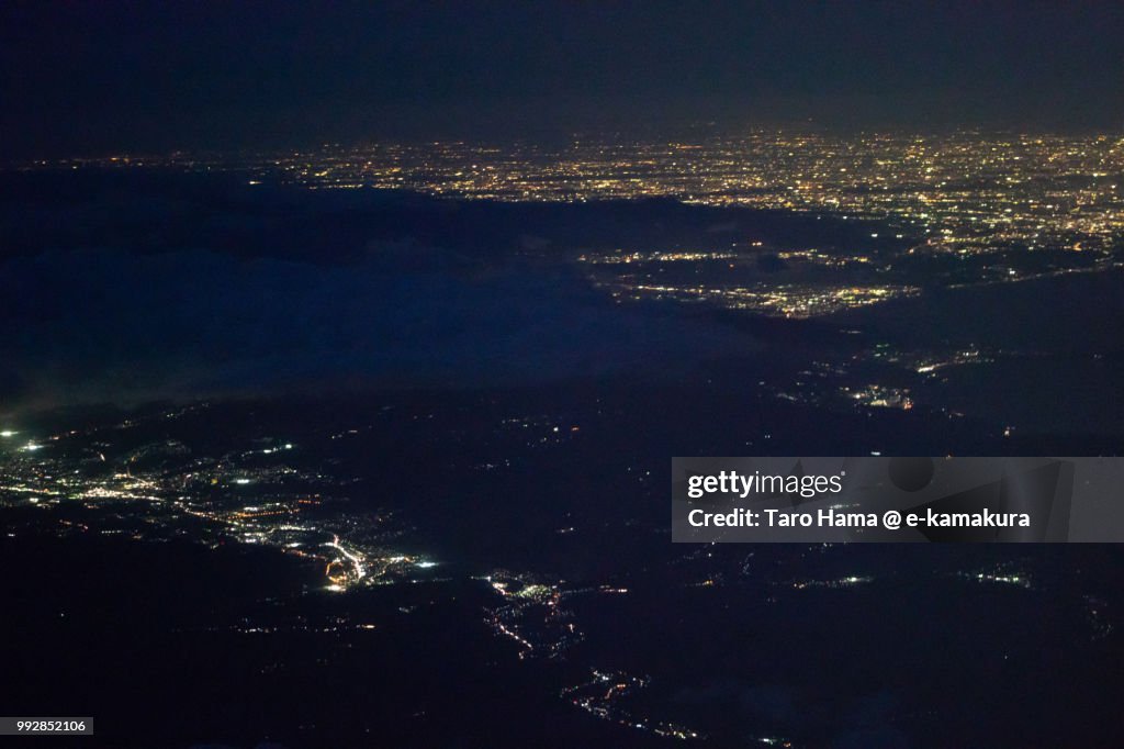 Mount Hakone, Suruga Bay, Mishima and Numazu cities in Shizuoka prefecture and Odawara and Hiratsuka cities in Kanagawa prefecture in Japan night time aerial view from airplane