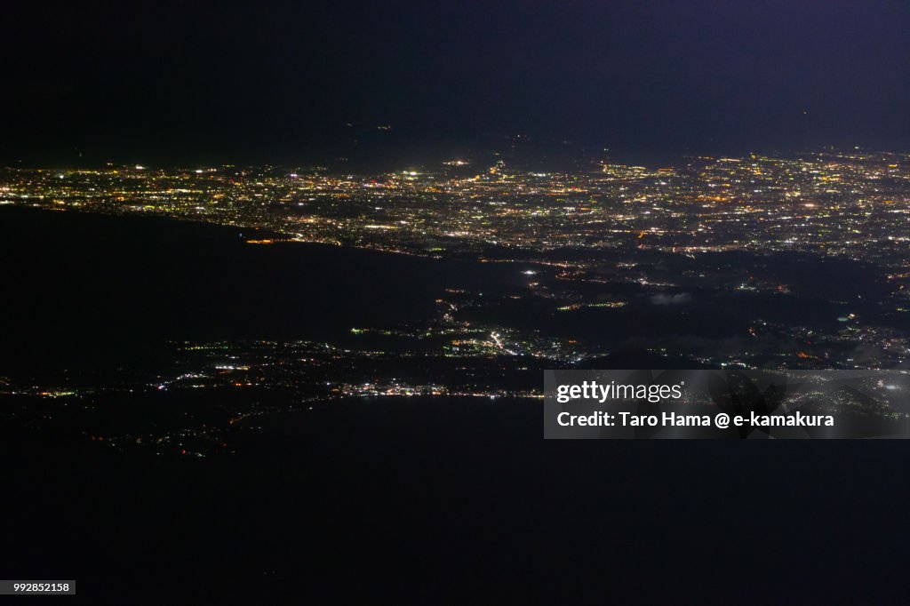 Tokyo Bay, Sagami Bay and Miura Peninsula in Kanagawa prefecture in Japan night time aerial view from airplane