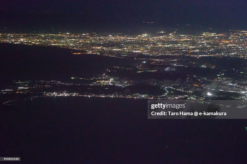 Tokyo Bay, Sagami Bay and Miura Peninsula in Kanagawa prefecture in Japan night time aerial view from airplane