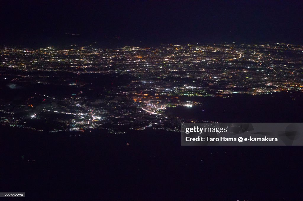 Tokyo Bay, Sagami Bay and Miura Peninsula in Kanagawa prefecture in Japan night time aerial view from airplane