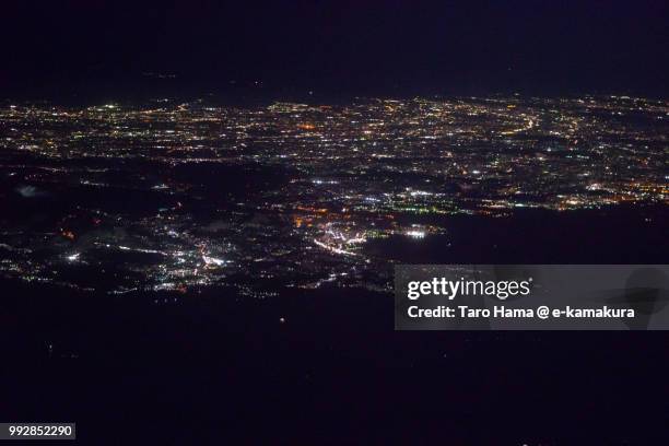 tokyo bay, sagami bay and miura peninsula in kanagawa prefecture in japan night time aerial view from airplane - zushi kanagawa bildbanksfoton och bilder