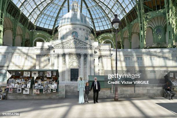 Adut Akech, Hudson Kronig and Karl Lagerfeld walk the runway during the Chanel Haute Couture Fall Winter 2018/2019 fashion show as part of Paris...