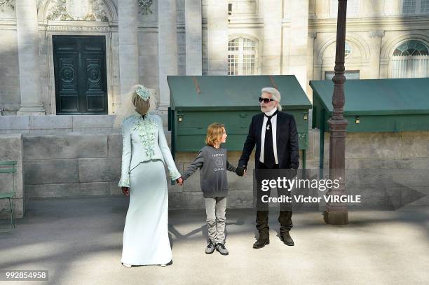 Adut Akech, Hudson Kronig and Karl Lagerfeld walks the runway during the Chanel Haute Couture Fall Winter 2018/2019 fashion show as part of Paris...