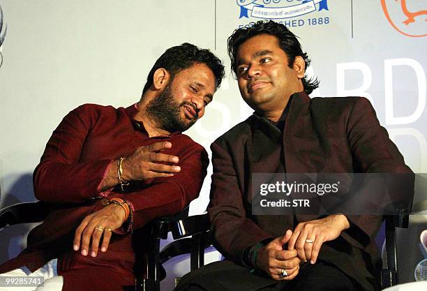 Indian Bollywood sound designer Resul Pookutty and A.R.Rahman attend the book launch event of Pookutty's autobiography in Mumbai on May 13, 2010. AFP...