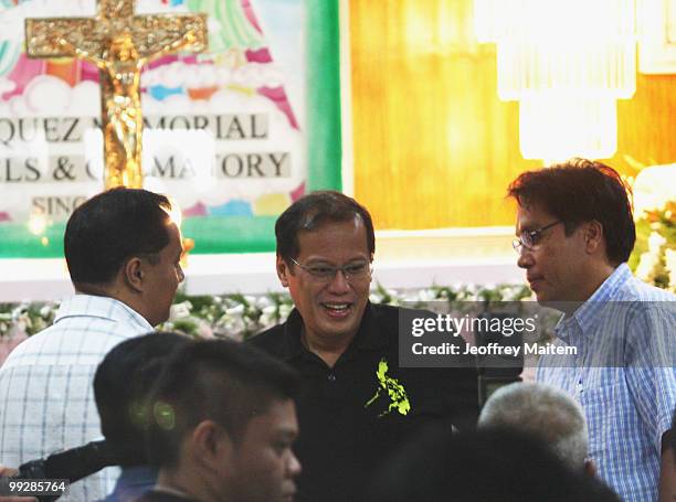 Benigno "Noynoy" Aquino is seen visiting a wake of his campaign staff killed on the day of election in Cavite as Aquino is unofficially announced as...