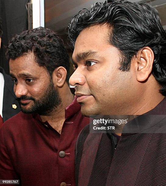 Indian Bollywood sound designer Resul Pookutty and A.R.Rahman attend the book launch event of Pookutty's autobiography in Mumbai on May 13, 2010. AFP...