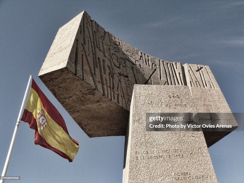Spanish flag and monument in Columbus Square, Madrid
